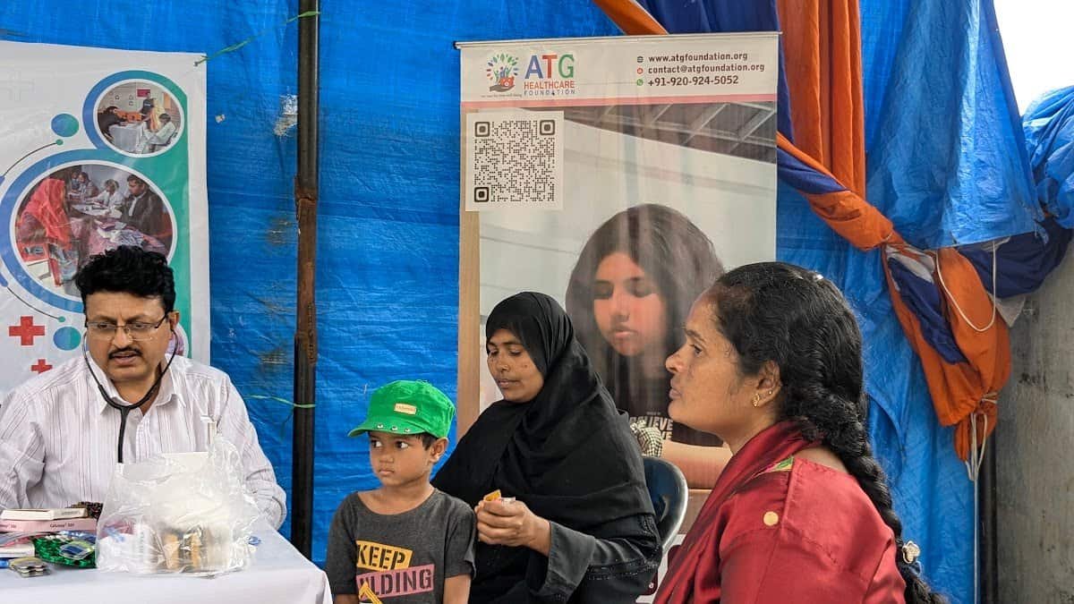 A doctor consulting a mother and child